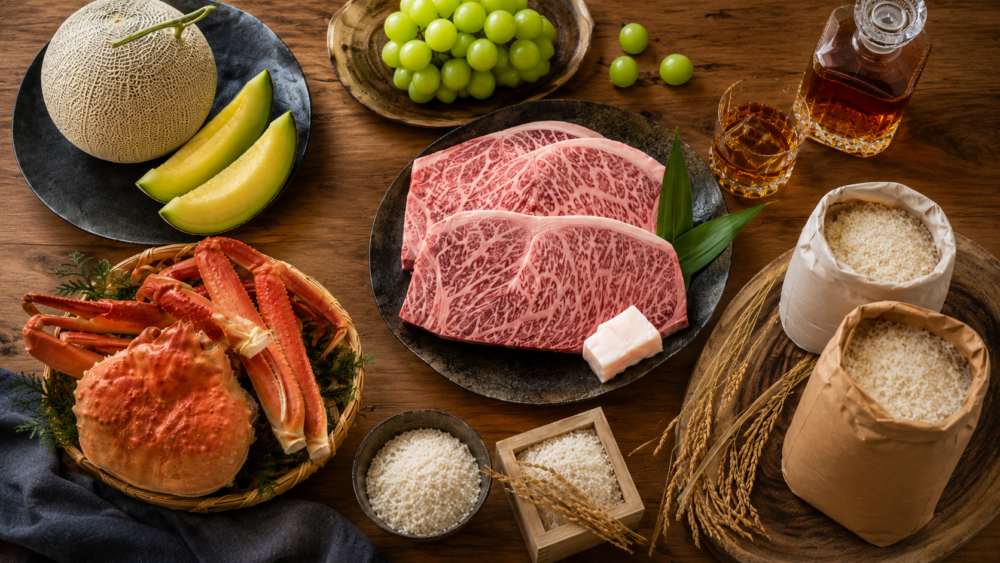 A spread of Furusato Nozei thank-you gifts—premium wagyu beef, rice, fruit and crab—from towns across Japan