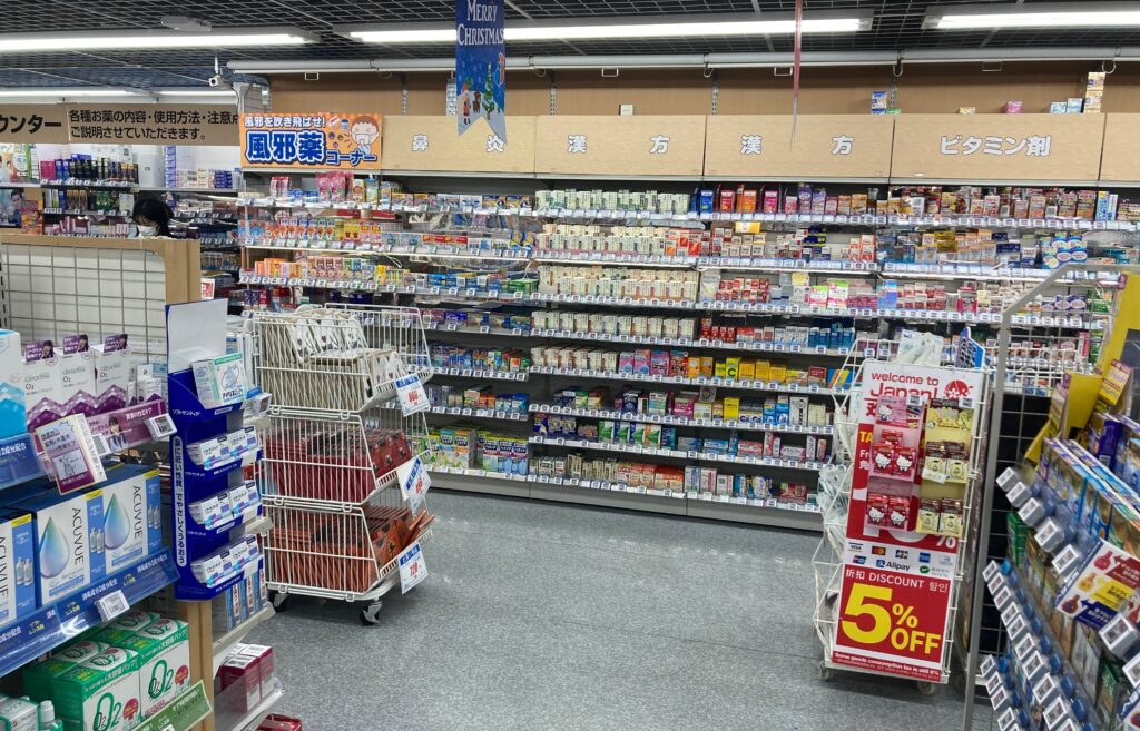 Over-the-counter medicine shelves inside a Japanese drugstore for buying without a prescription